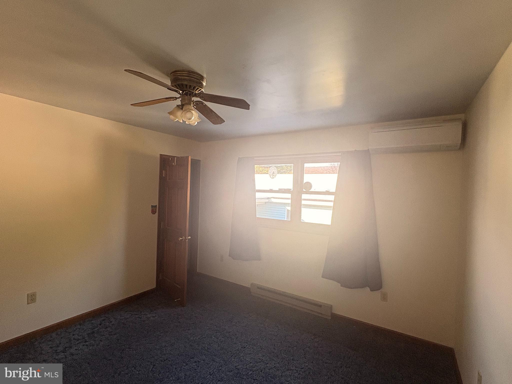 3189 Powells Valley Road Halifax, PA 17032 - Photo 19 of 44 an empty room with windows and fan