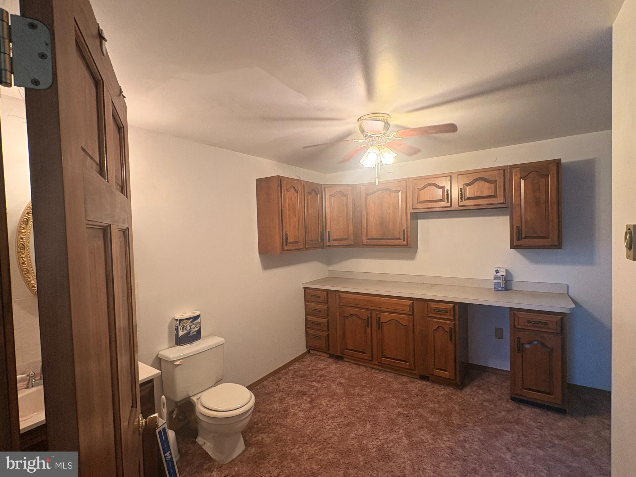 3189 Powells Valley Road Halifax, PA 17032 - Photo 21 of 44 a bathroom with a sink a toilet a mirror and vanity