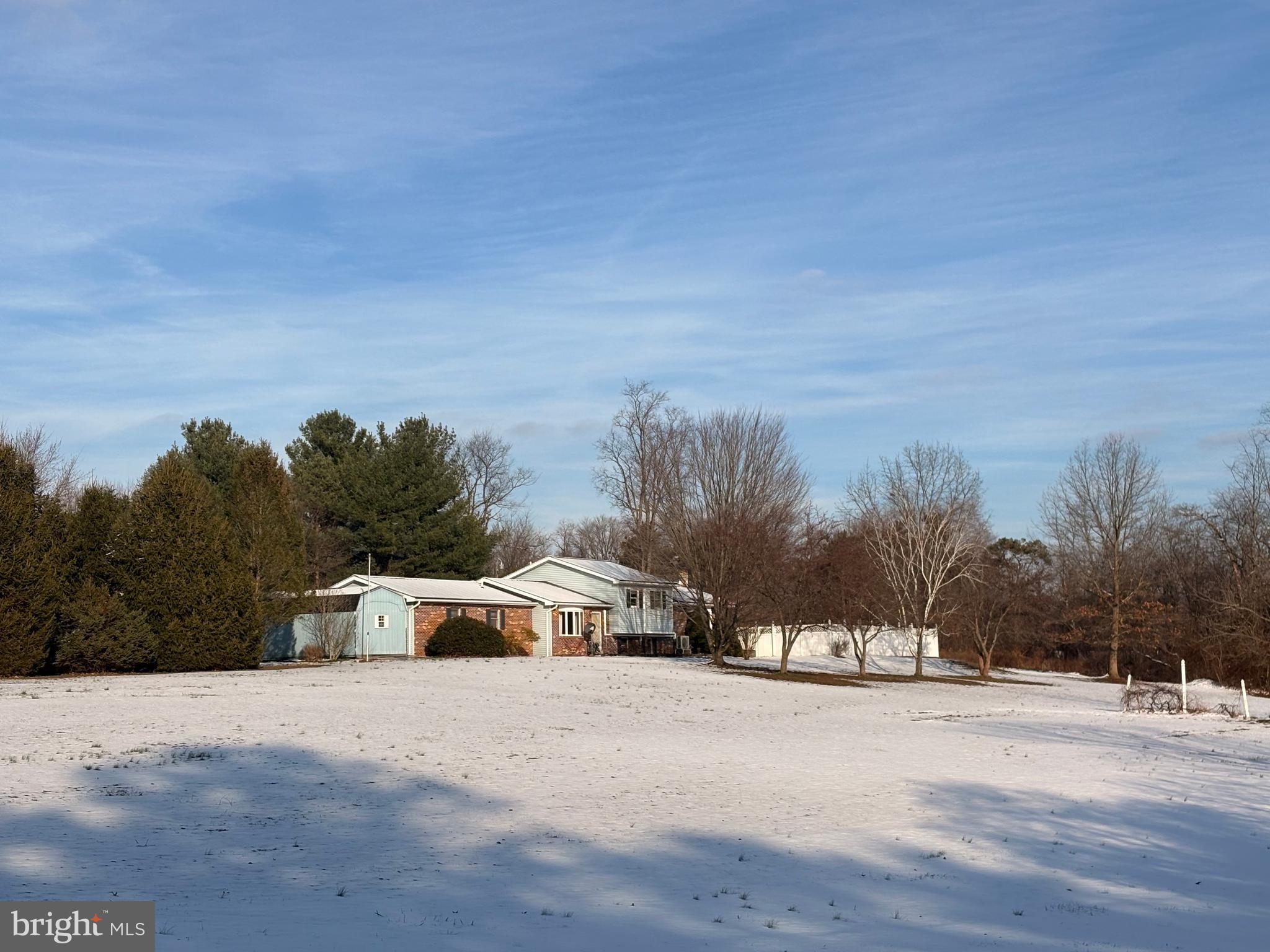 3189 Powells Valley Road Halifax, PA 17032 - Photo 42 of 44 a view of a white house with a yard and trees