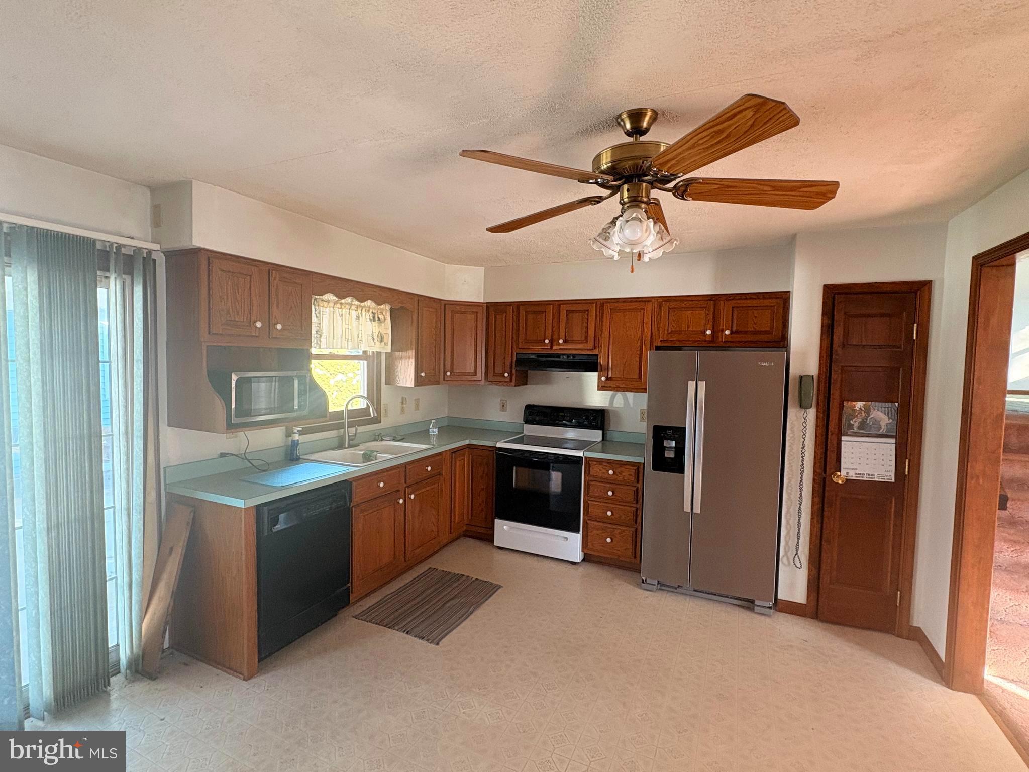 3189 Powells Valley Road Halifax, PA 17032 - Photo 7 of 44 a kitchen with stainless steel appliances granite countertop a refrigerator a sink dishwasher a stove and a refrigerator