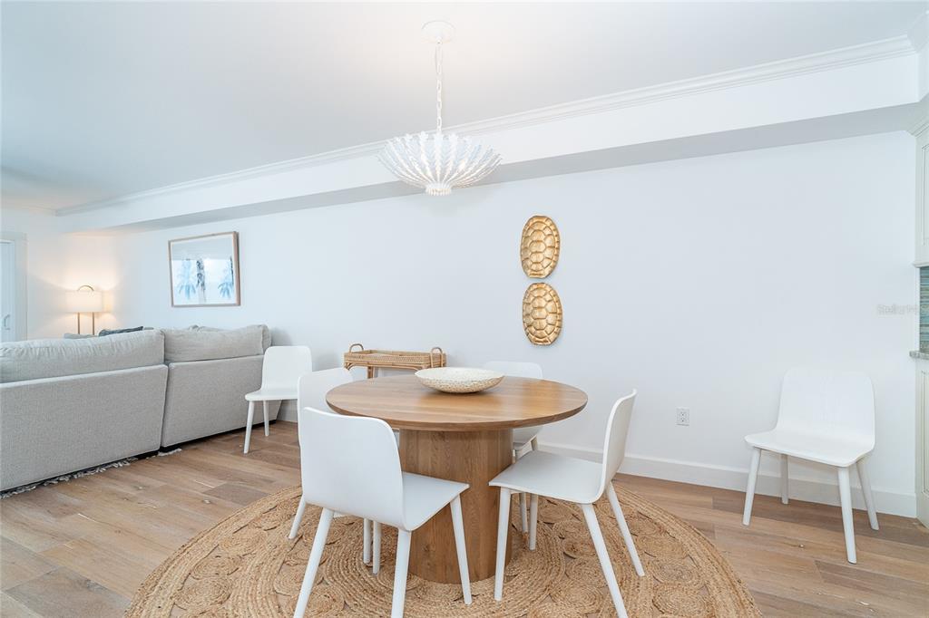 301 South Gulf Boulevard, Unit 25 Placida, FL 33946 - Photo 15 of 68 a view of a dining room with furniture and wooden floor