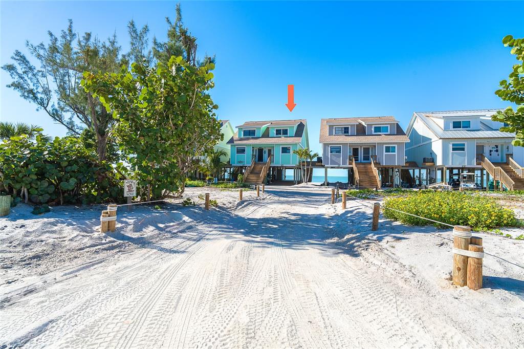 301 South Gulf Boulevard, Unit 25 Placida, FL 33946 - Photo 2 of 68 a front view of a house with a yard
