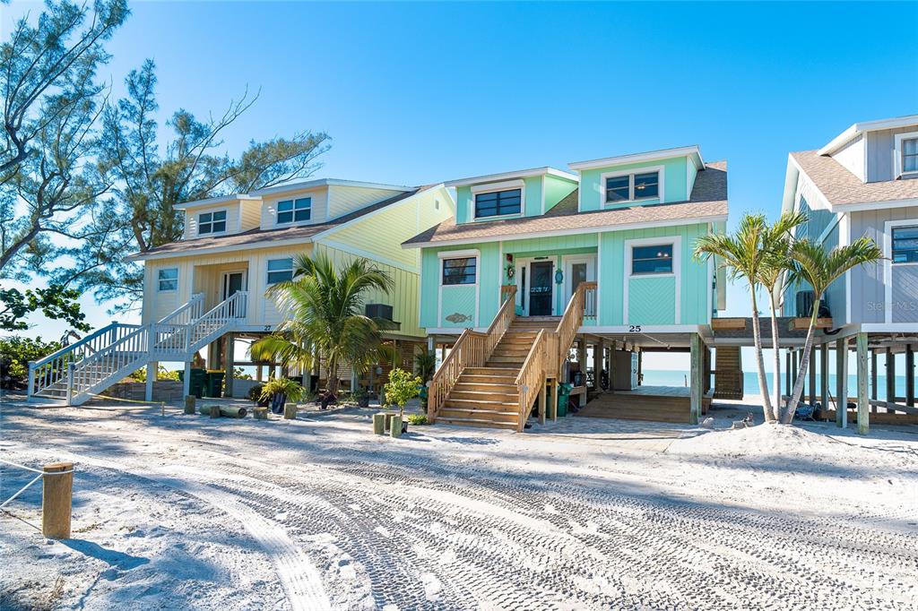 301 South Gulf Boulevard, Unit 25 Placida, FL 33946 - Photo 3 of 68 a view of house with a bench in front of it
