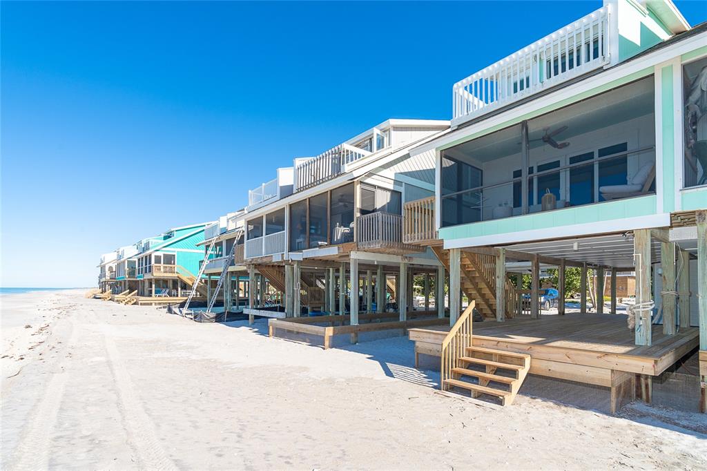 301 South Gulf Boulevard, Unit 25 Placida, FL 33946 - Photo 47 of 68 a building outdoor space with patio furniture and a potted plant