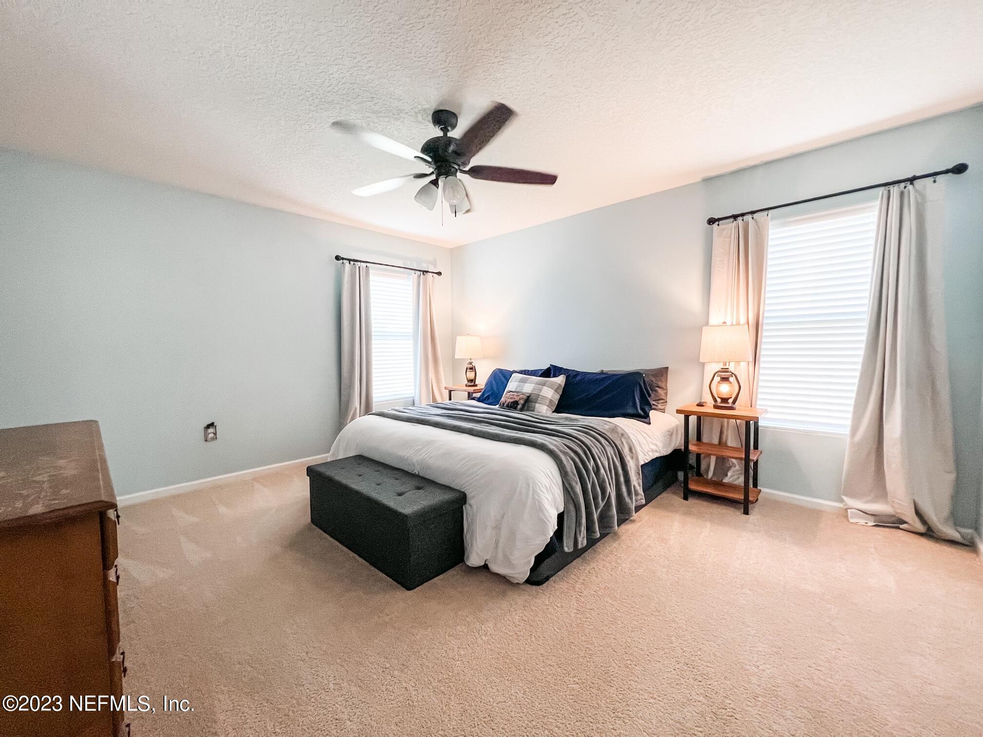 45190 Dutton Way Callahan, FL 32011 - Photo 20 of 29 a bedroom with a bed and a window