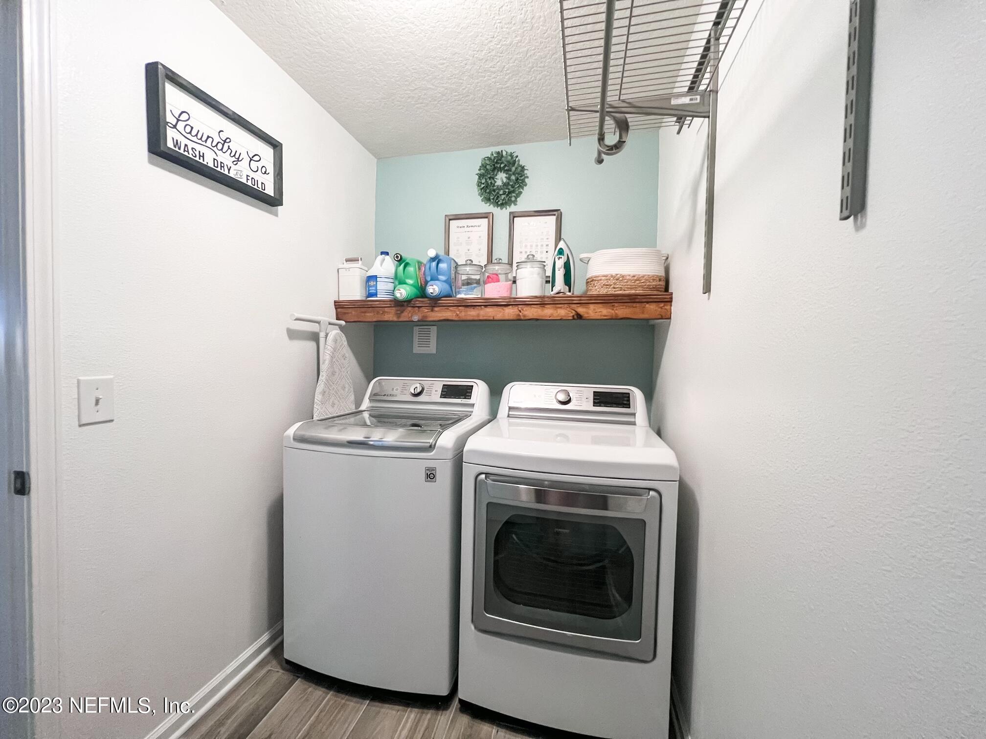 45190 Dutton Way Callahan, FL 32011 - Photo 23 of 29 a utility room with dryer and washer