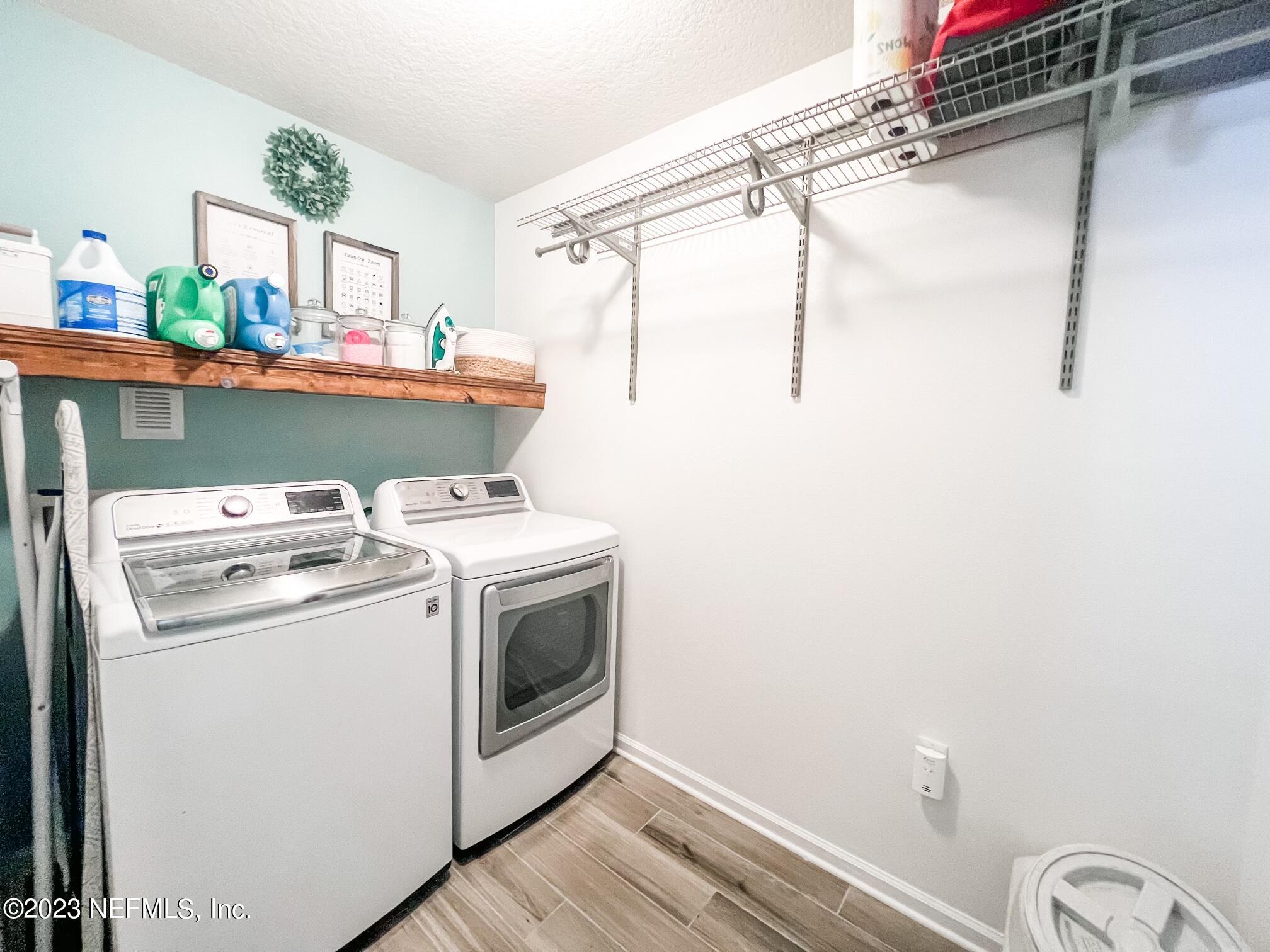 45190 Dutton Way Callahan, FL 32011 - Photo 24 of 29 a utility room with dryer and washer