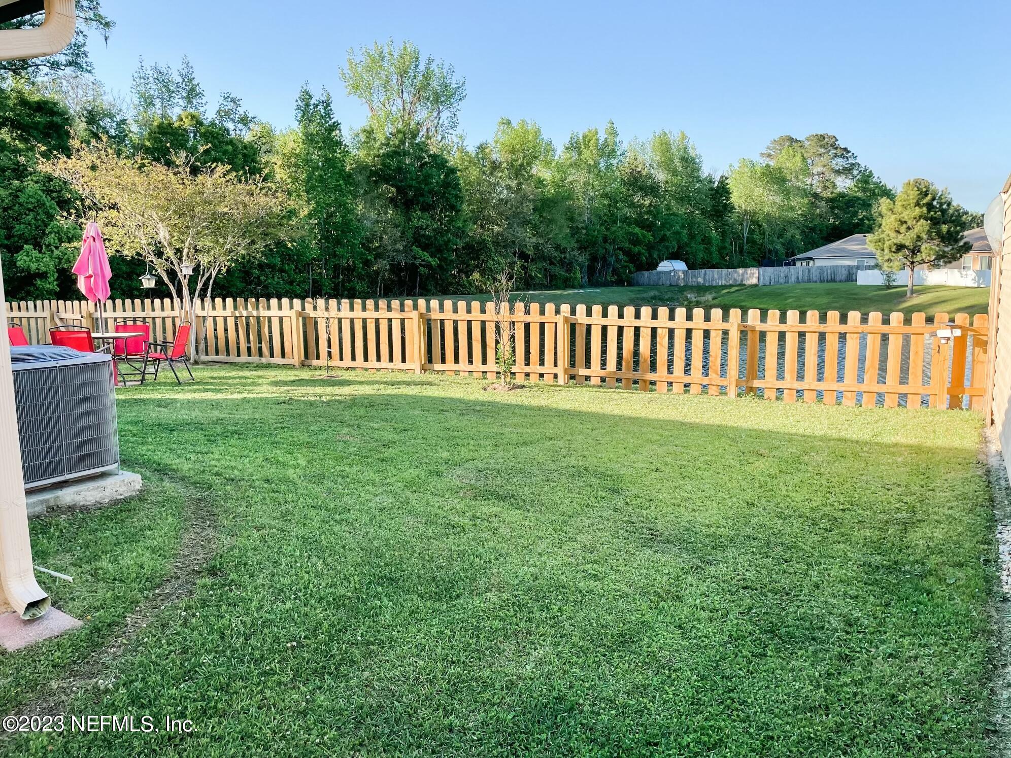 45190 Dutton Way Callahan, FL 32011 - Photo 25 of 29 a front view of a garden
