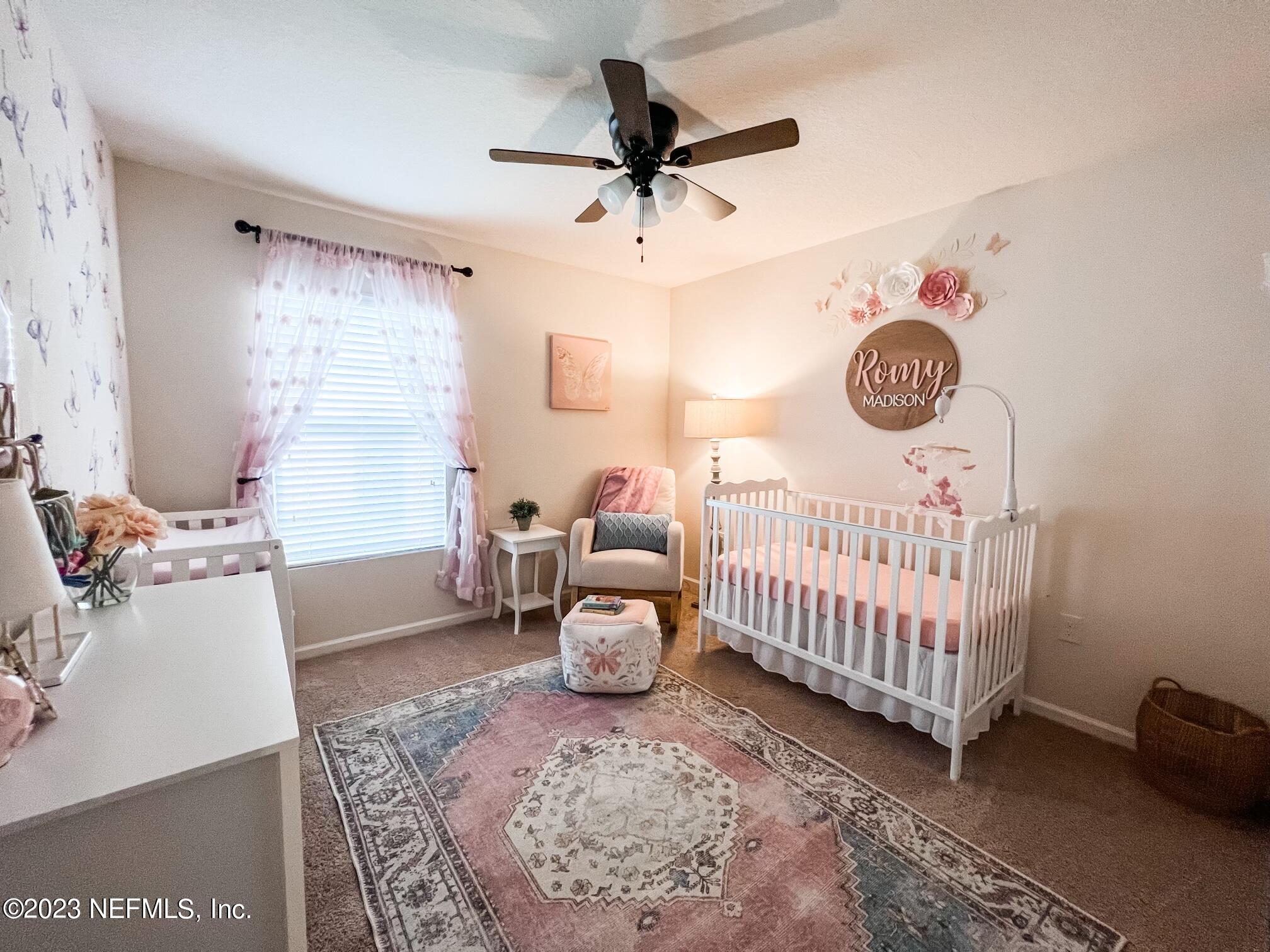 45190 Dutton Way Callahan, FL 32011 - Photo 5 of 29 a bedroom with furniture and a window