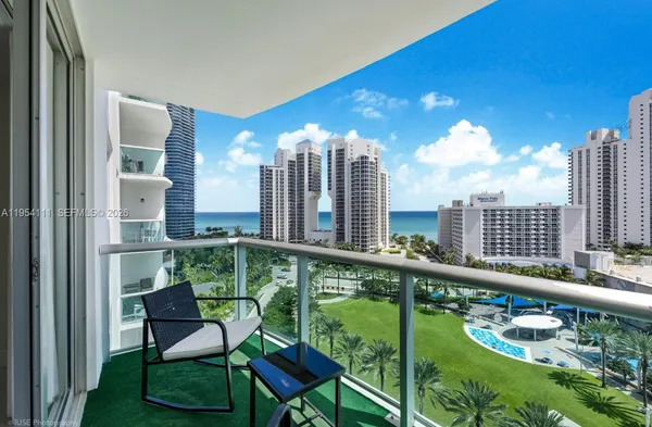 a view of a balcony with chairs