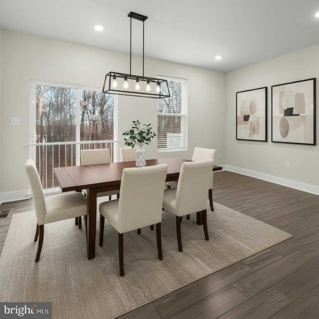 304 Sweetbay Road Essex, MD 21221 - Photo 14 of 66 a view of a dining room with furniture window and wooden floor