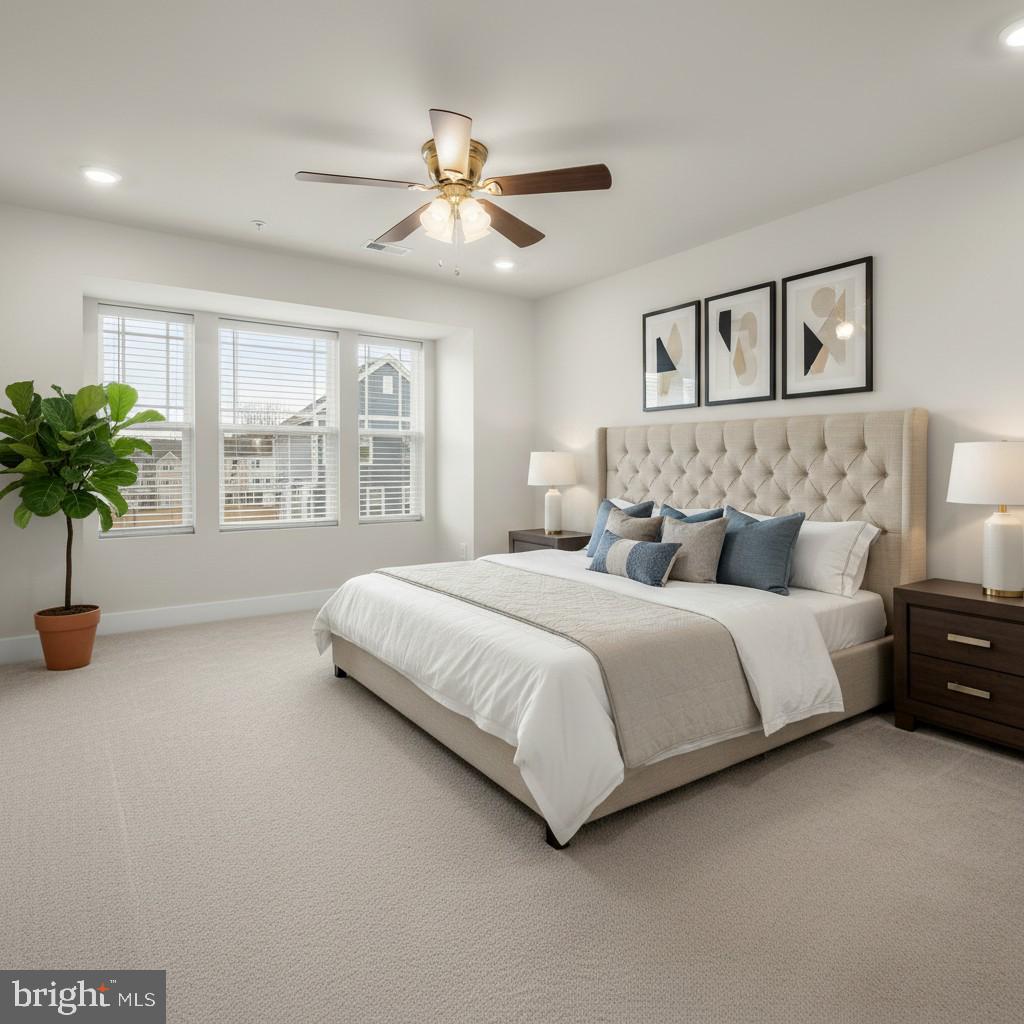 304 Sweetbay Road Essex, MD 21221 - Photo 18 of 66 a spacious bedroom with a bed and a chandelier