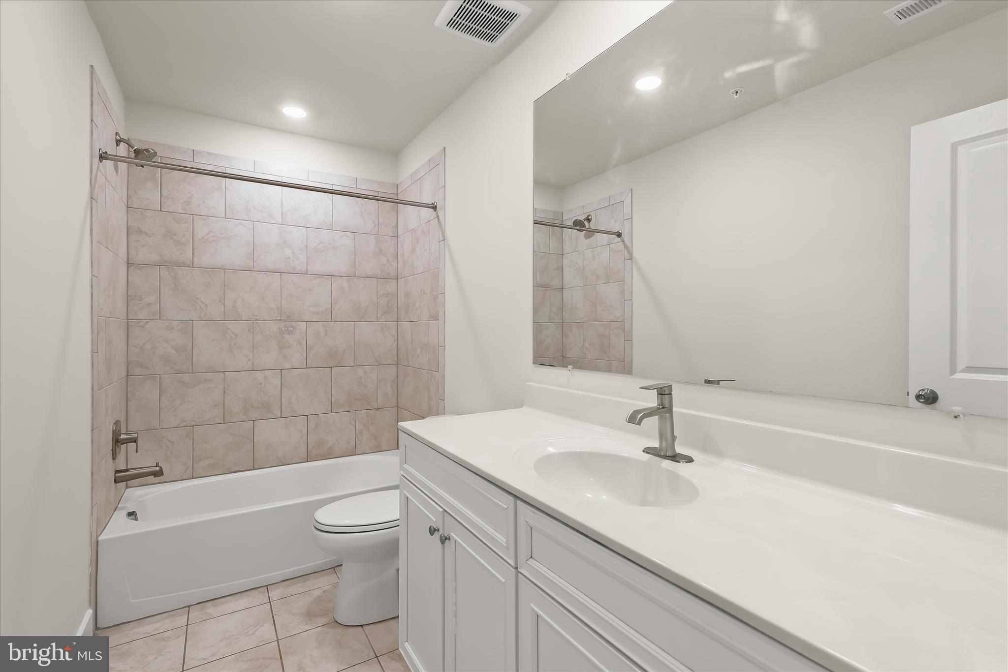 304 Sweetbay Road Essex, MD 21221 - Photo 30 of 66 a bathroom with a sink a toilet and shower