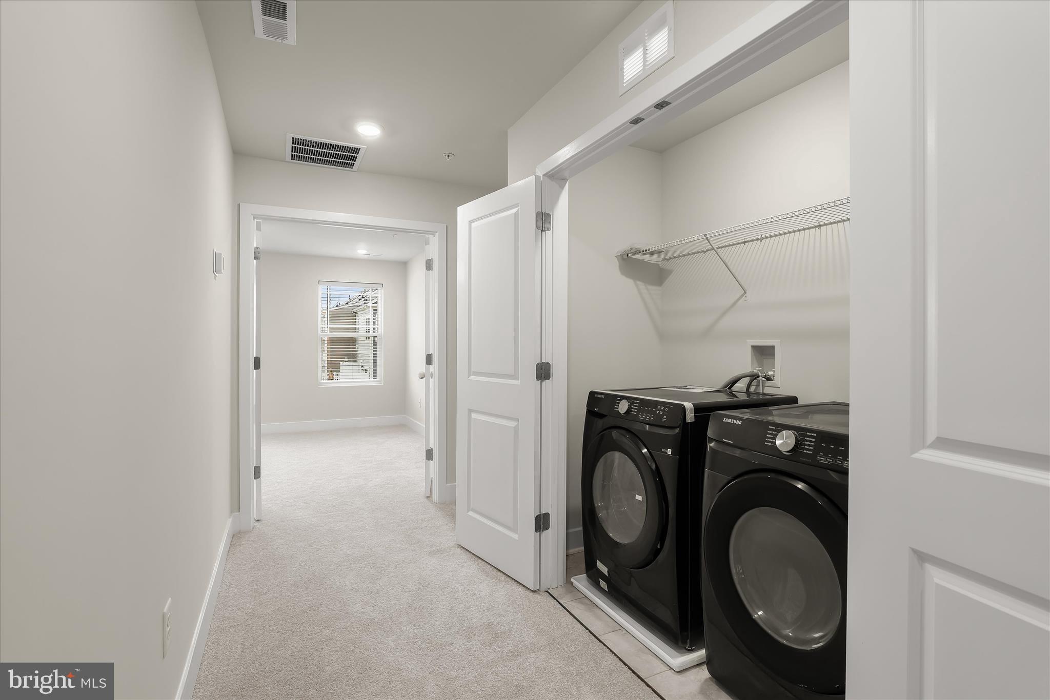 304 Sweetbay Road Essex, MD 21221 - Photo 31 of 66 a view of a storage & utility room with washer and dryer