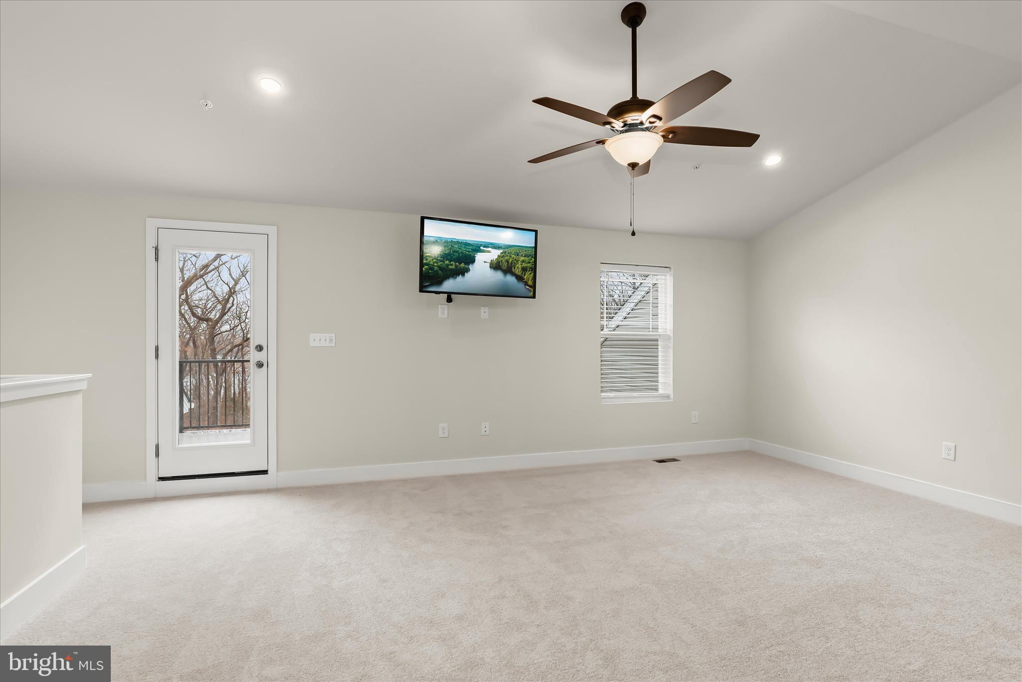 304 Sweetbay Road Essex, MD 21221 - Photo 33 of 66 an empty room with windows and fan