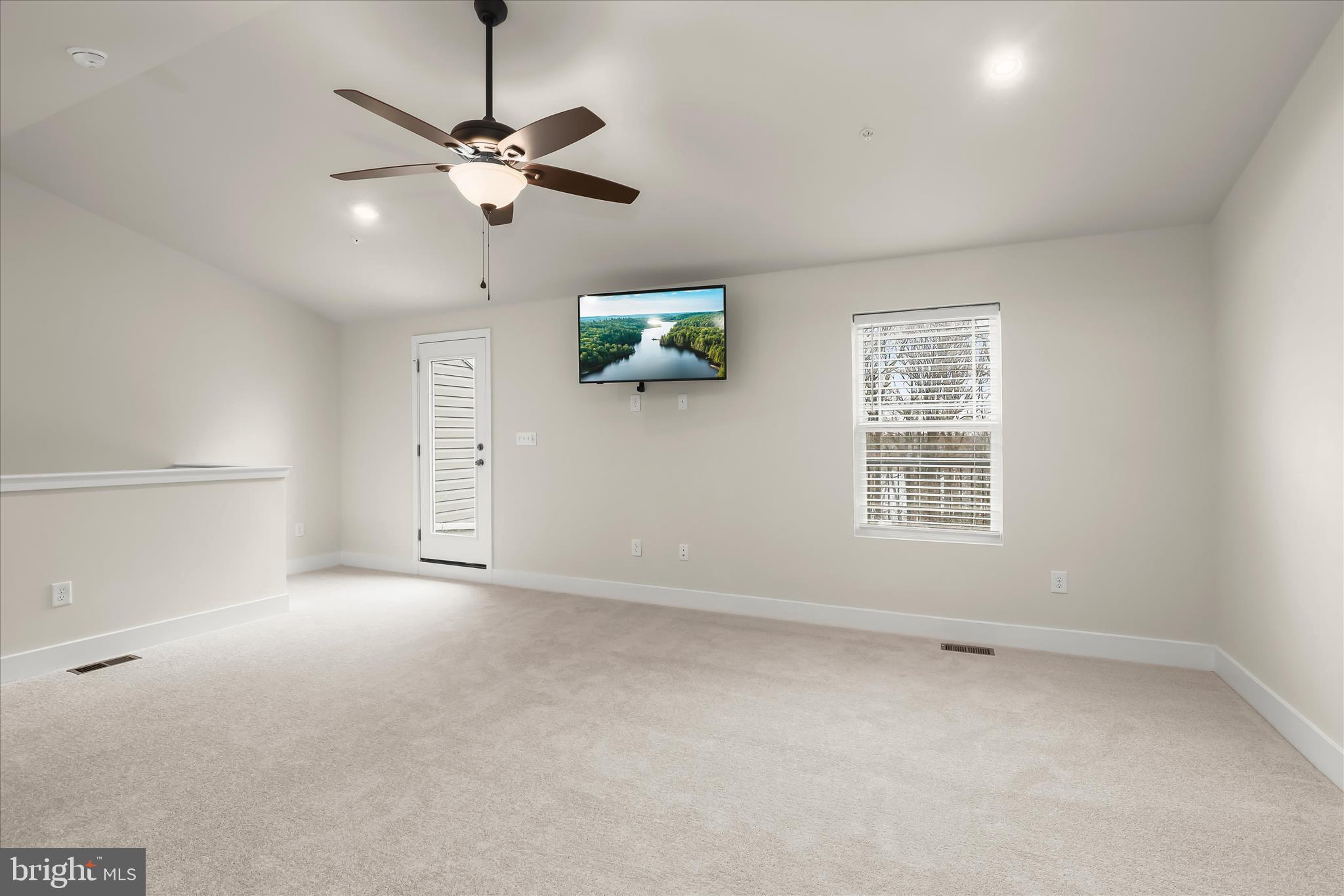 304 Sweetbay Road Essex, MD 21221 - Photo 34 of 66 an empty room with ceiling fan and windows