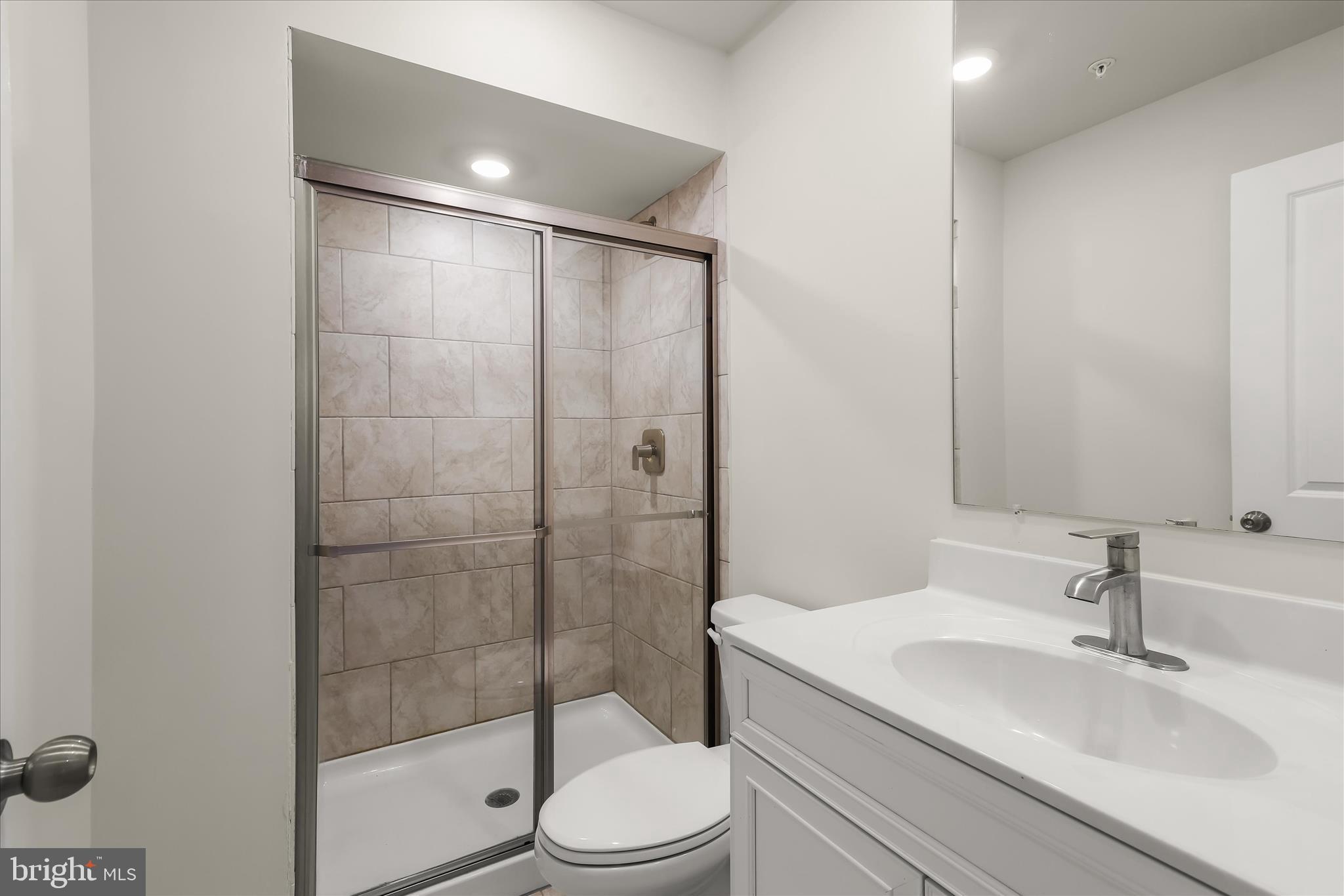 304 Sweetbay Road Essex, MD 21221 - Photo 43 of 66 a bathroom with a sink toilet and shower