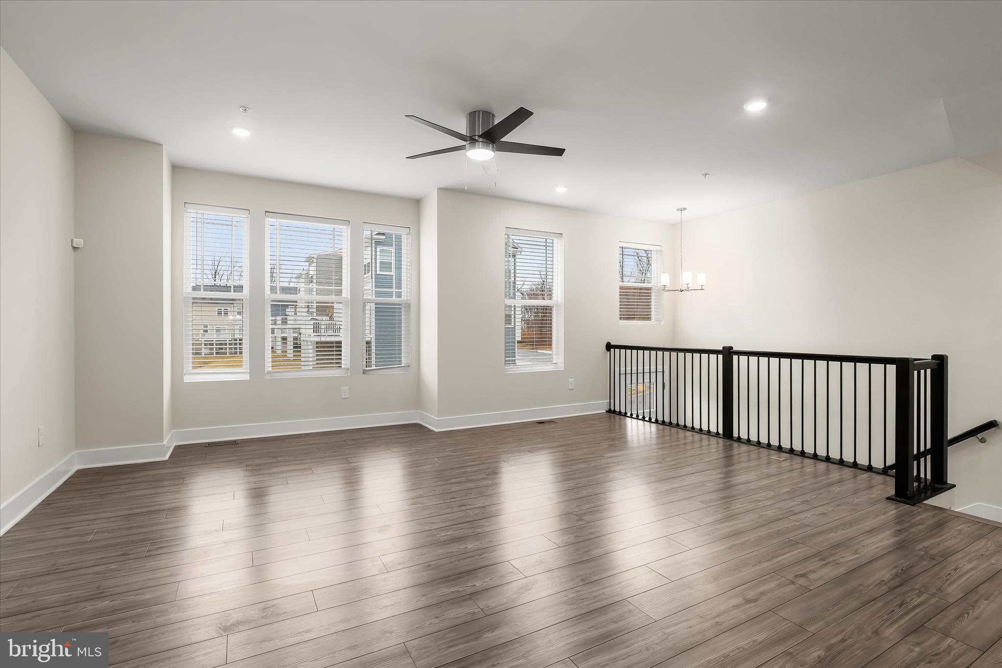 304 Sweetbay Road Essex, MD 21221 - Photo 5 of 66 a view of an empty room with wooden floor and a window