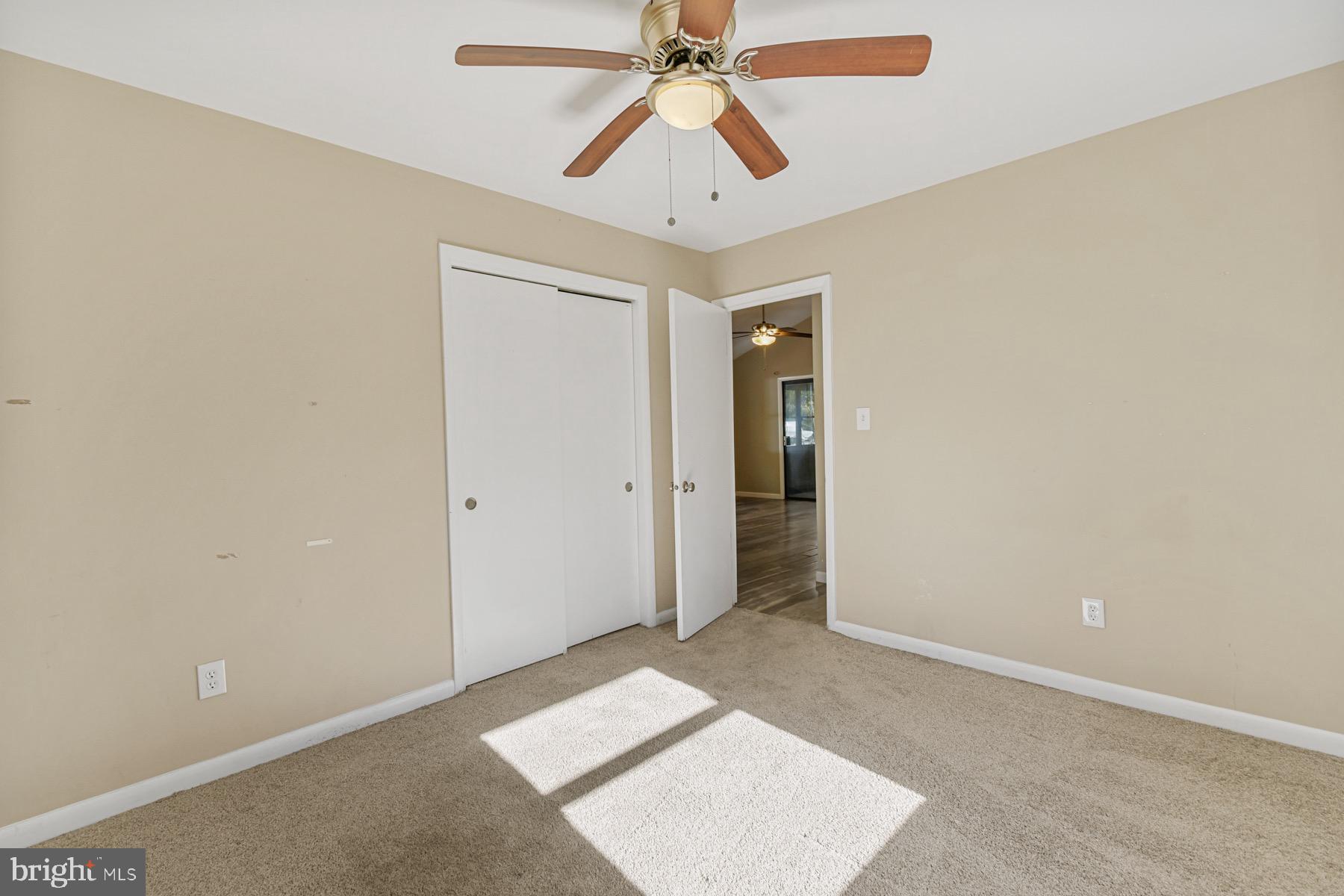 3 Birdnest Drive Ocean Pines, MD 21811 - Photo 20 of 29 an empty room with closet and a chandelier fan