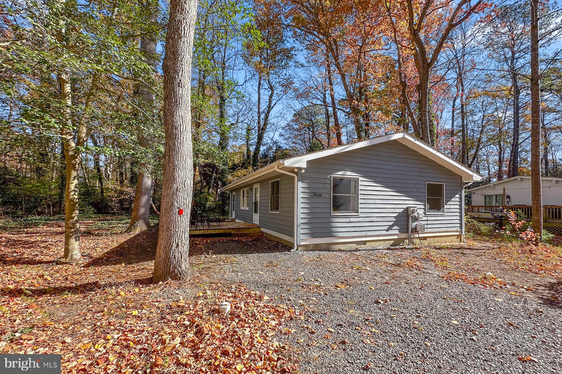 3 Birdnest Drive Ocean Pines, MD 21811 - Photo 3 of 29 a view of a house with a yard covered in snow