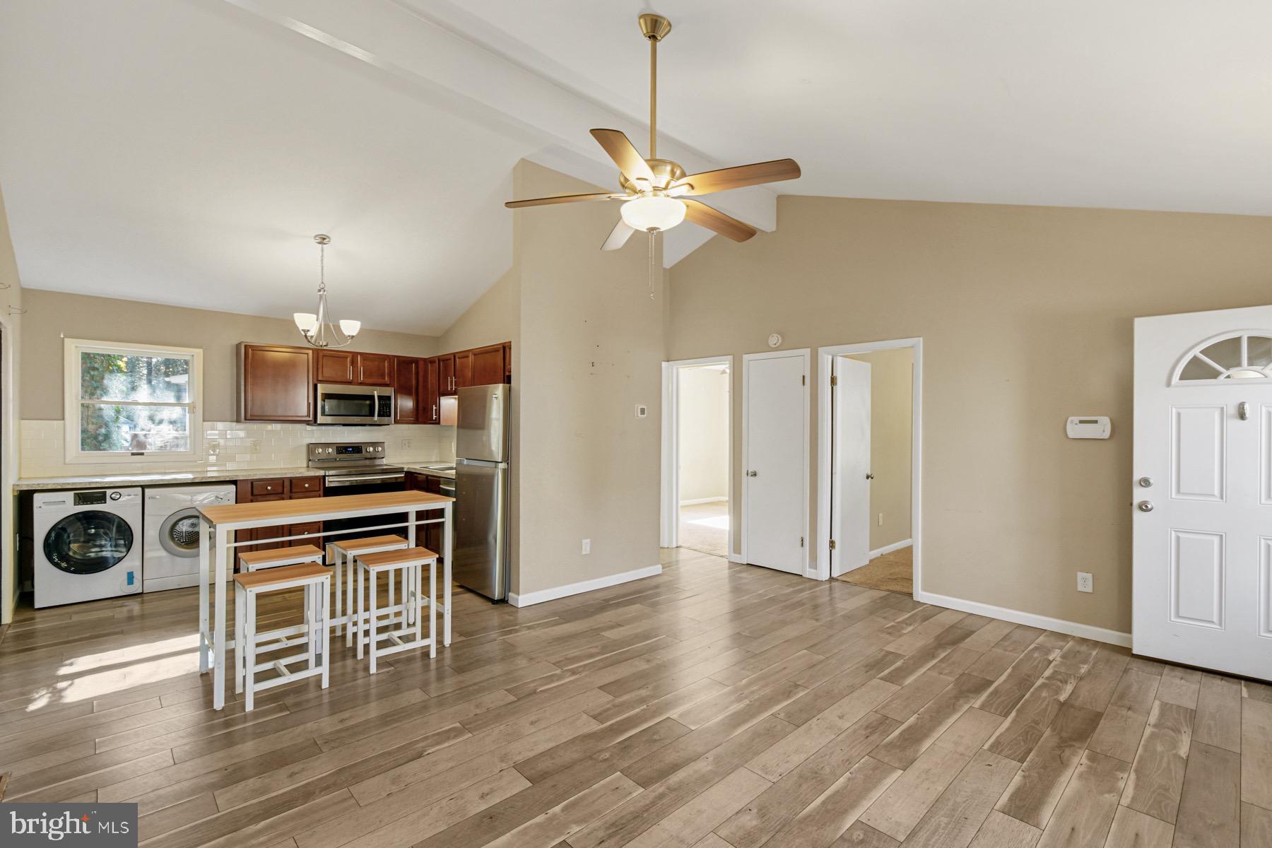 3 Birdnest Drive Ocean Pines, MD 21811 - Photo 6 of 29 a view of a kitchen with wooden floor and a ceiling fan
