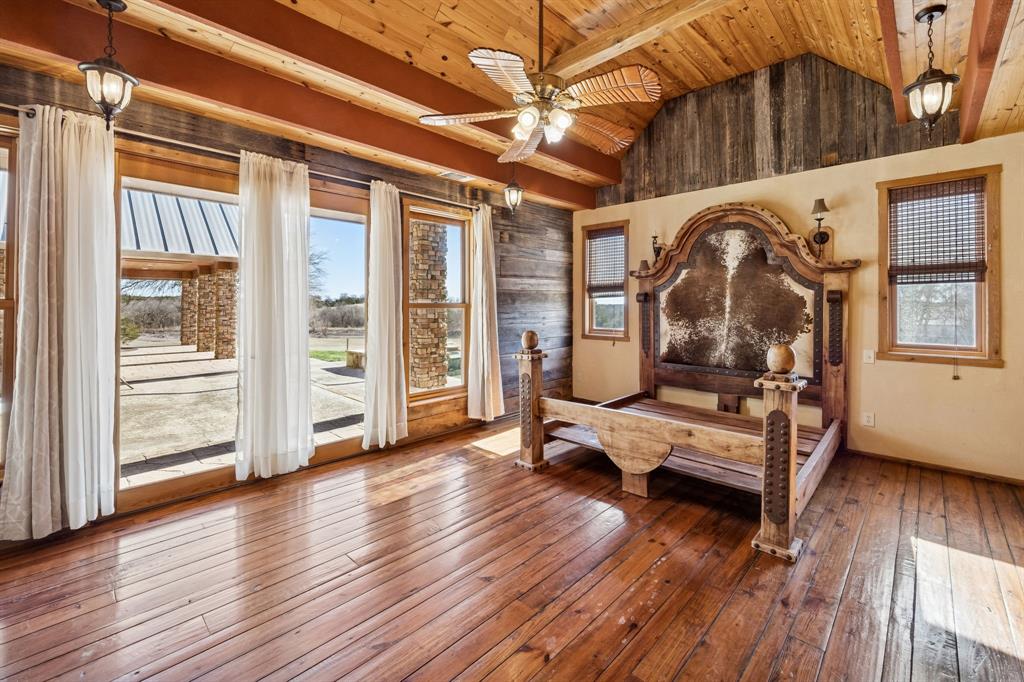 1922 A Bethel-Cannon Road Whitewright, TX 75491 - Photo 13 of 40 Vaulted wood-paneled ceiling with exposed beams