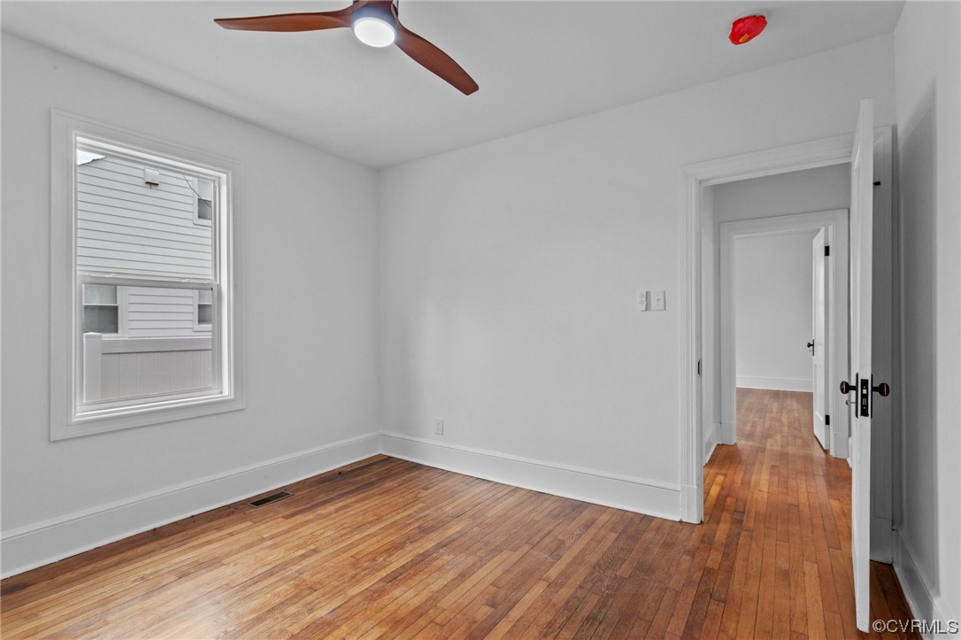2217 Bailey Drive Henrico, VA 23231 - Photo 14 of 25 a view of an empty room with wooden floor and a window