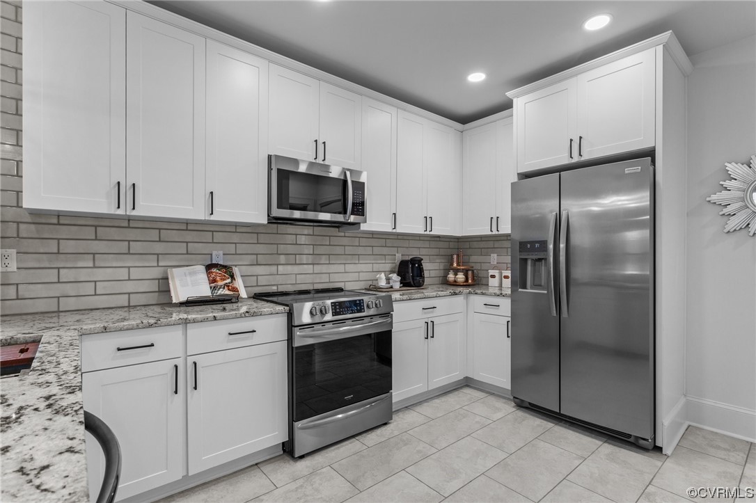 2217 Bailey Drive Henrico, VA 23231 - Photo 5 of 25 a kitchen with white cabinets stainless steel appliances and a sink