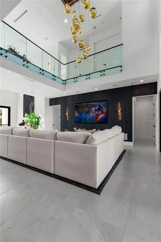 a kitchen with kitchen island stainless steel appliances a sink and cabinets