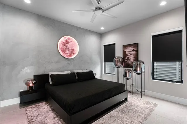 a dining room with furniture water view and a floor to ceiling window