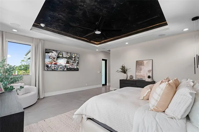 a view of an house with backyard and sitting area