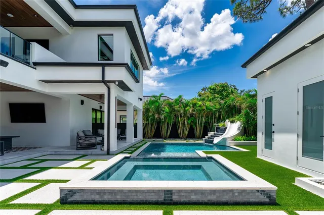 a view of an house with backyard porch and patio