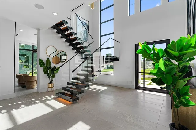 a view of entryway and hall with wooden floor