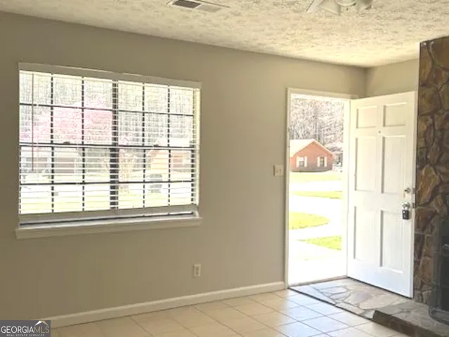 a view of a room that has a window in it