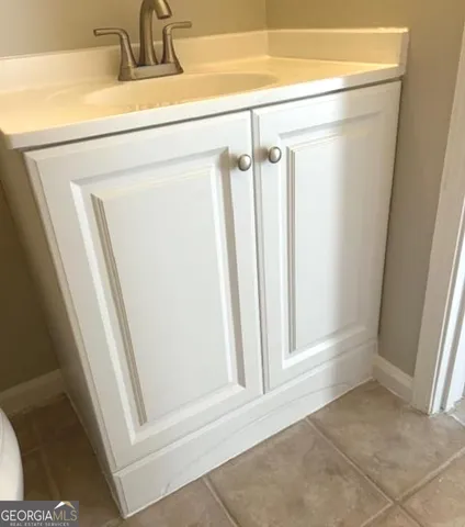 a view of a bathroom from a door
