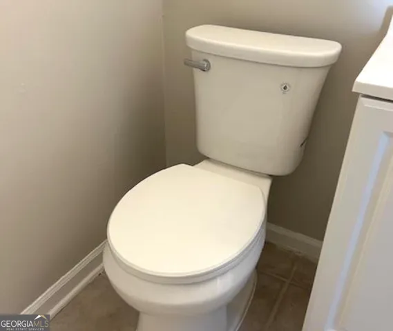 a bathroom with a toilet and a sink
