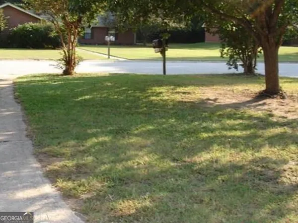 a view of a swimming pool with an outdoor space and seating area