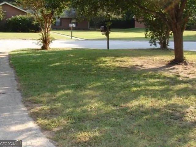 a view of a swimming pool with an outdoor space and seating area