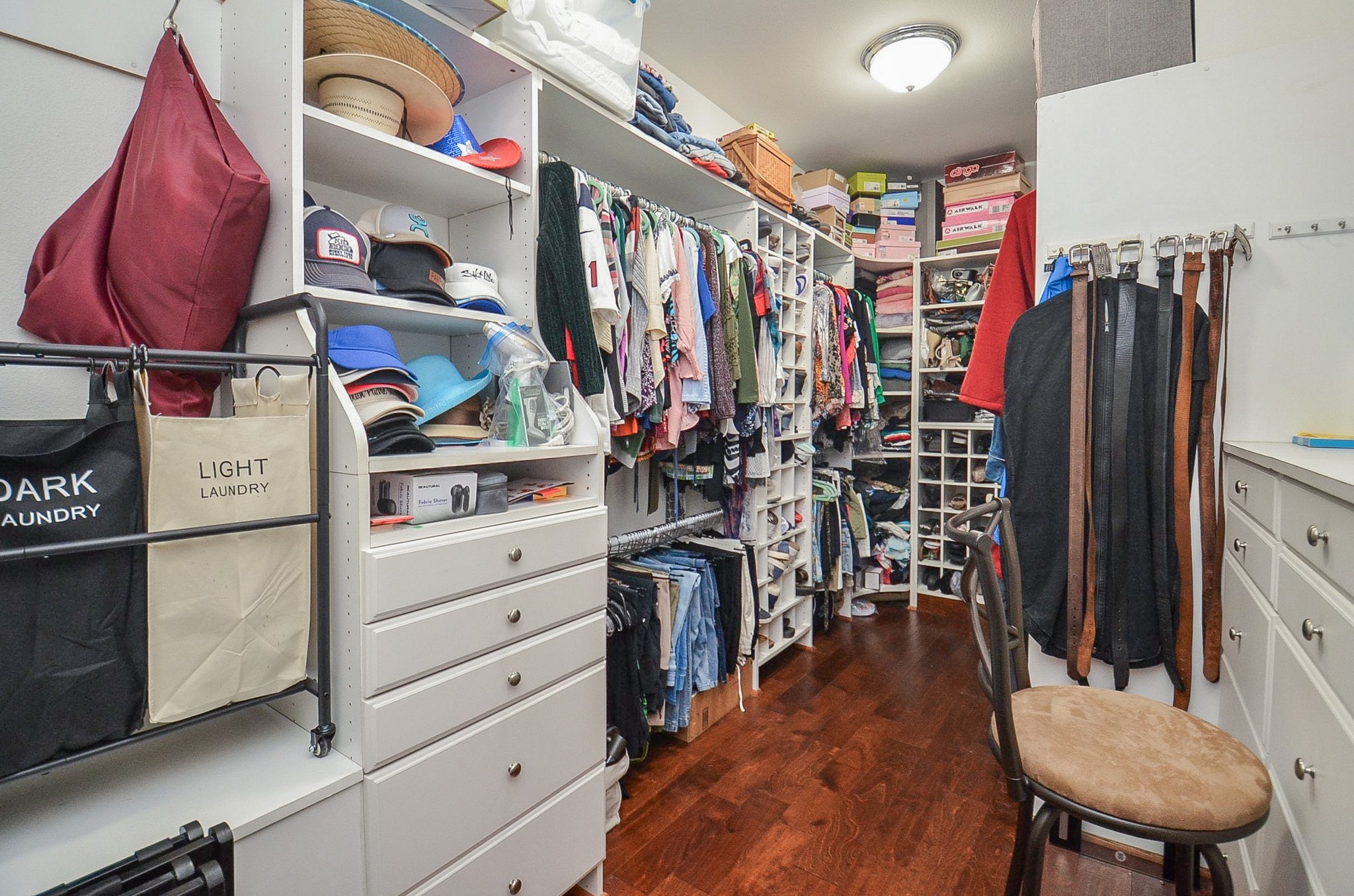 27644 Spring Hill Road Hempstead, TX 77445 - Photo 27 of 50 This primary walk-in closet may be mistaken for a private, cozy bedroom! Wall/floor space accommodates every hanging, organizing need!