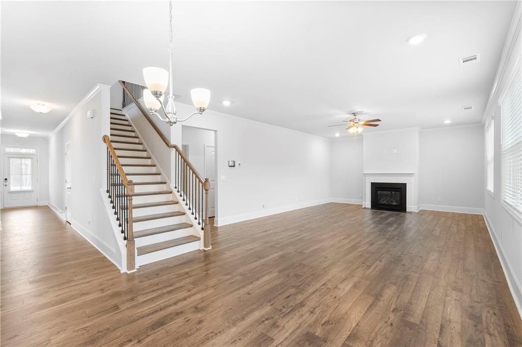 42 Citrine Way Acworth, GA 30101 - Photo 13 of 55 a view of a livingroom with wooden floor and stairs