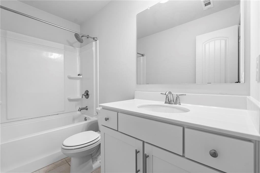 42 Citrine Way Acworth, GA 30101 - Photo 44 of 55 a bathroom with a sink a toilet and a bathtub