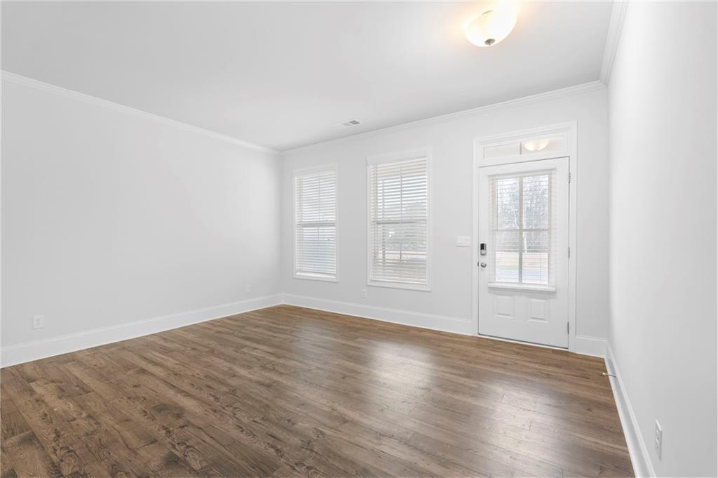 42 Citrine Way Acworth, GA 30101 - Photo 5 of 55 an empty room with wooden floor and windows
