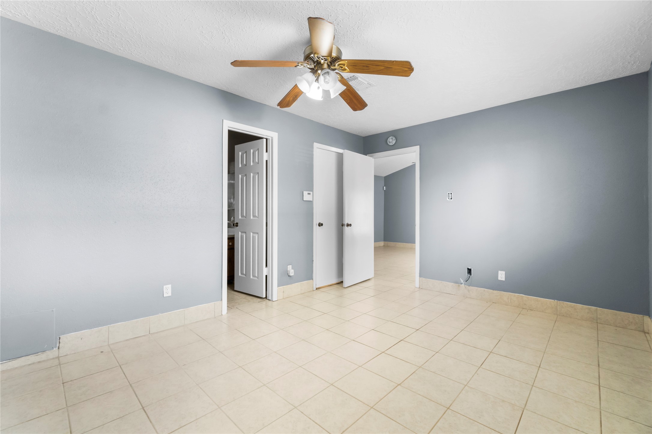 23202 Summergate Drive Spring, TX 77373 - Photo 14 of 16 a view of an empty room and chandelier fan