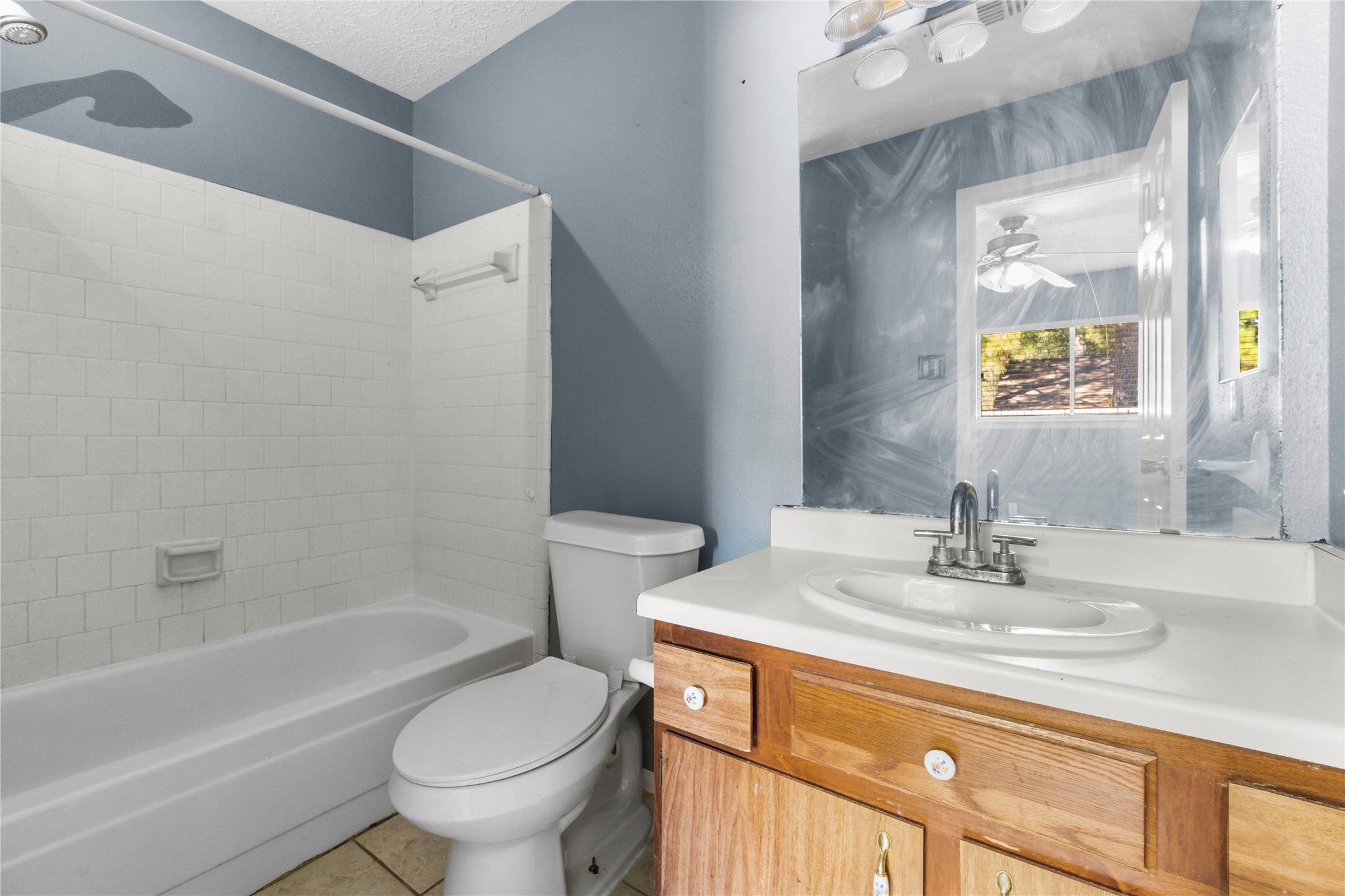 23202 Summergate Drive Spring, TX 77373 - Photo 15 of 16 a bathroom with a sink toilet and a bathtub