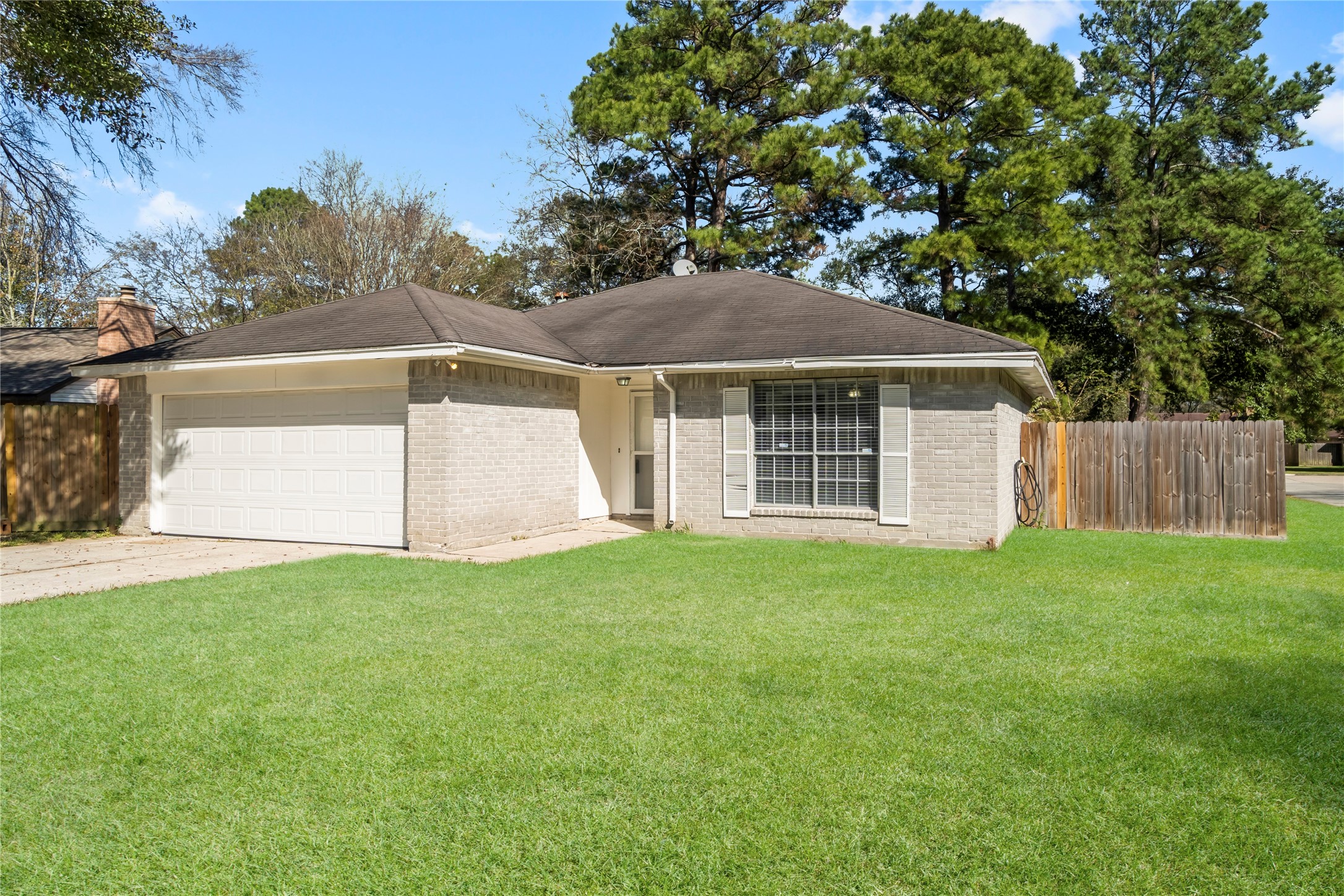 23202 Summergate Drive Spring, TX 77373 - Photo 2 of 16 a backyard of a house with lots of green space