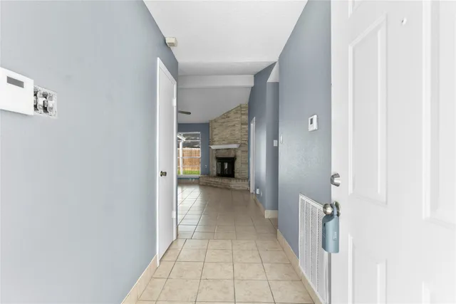 a view of a hallway with a white walls