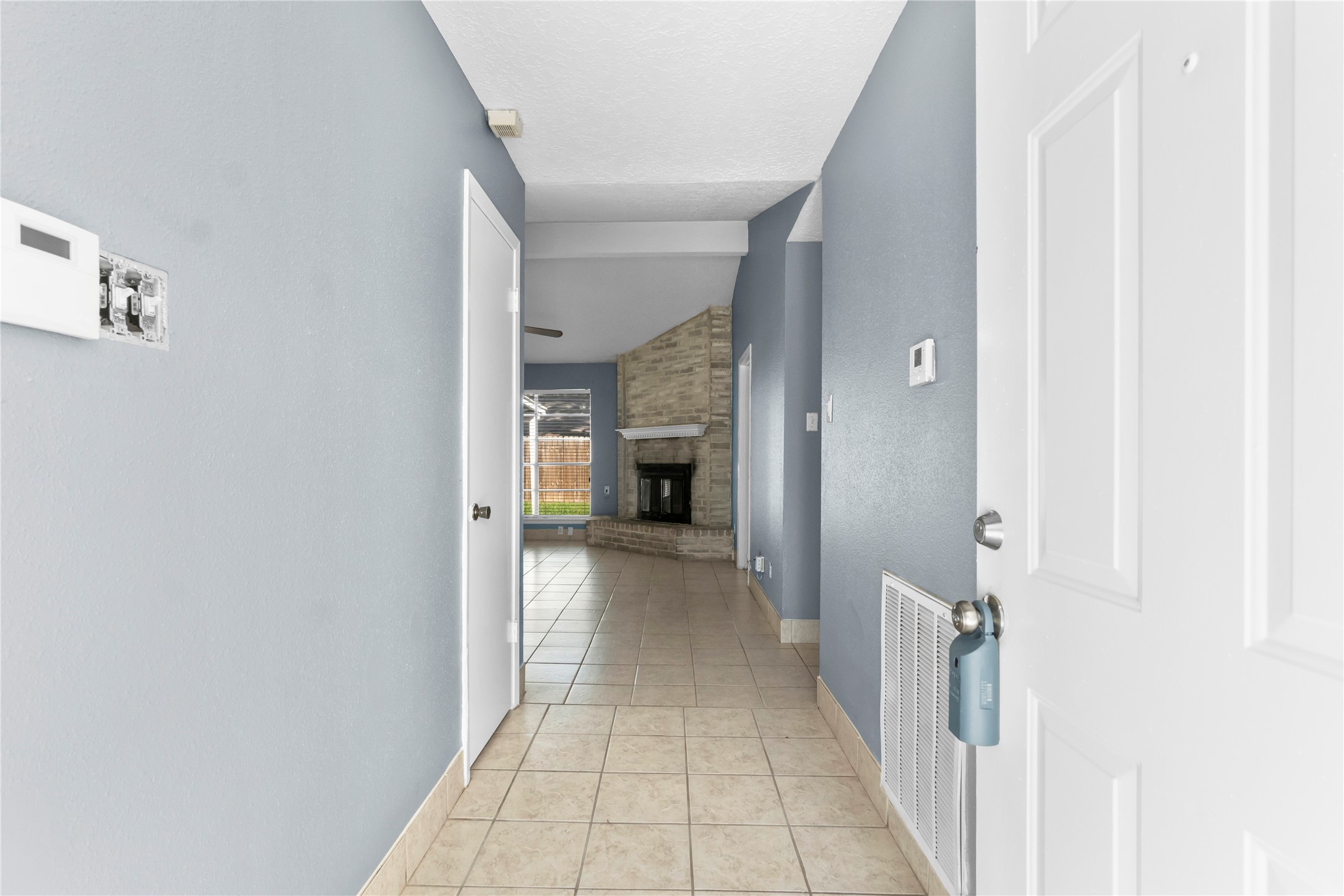 23202 Summergate Drive Spring, TX 77373 - Photo 5 of 16 a view of a hallway with a white walls