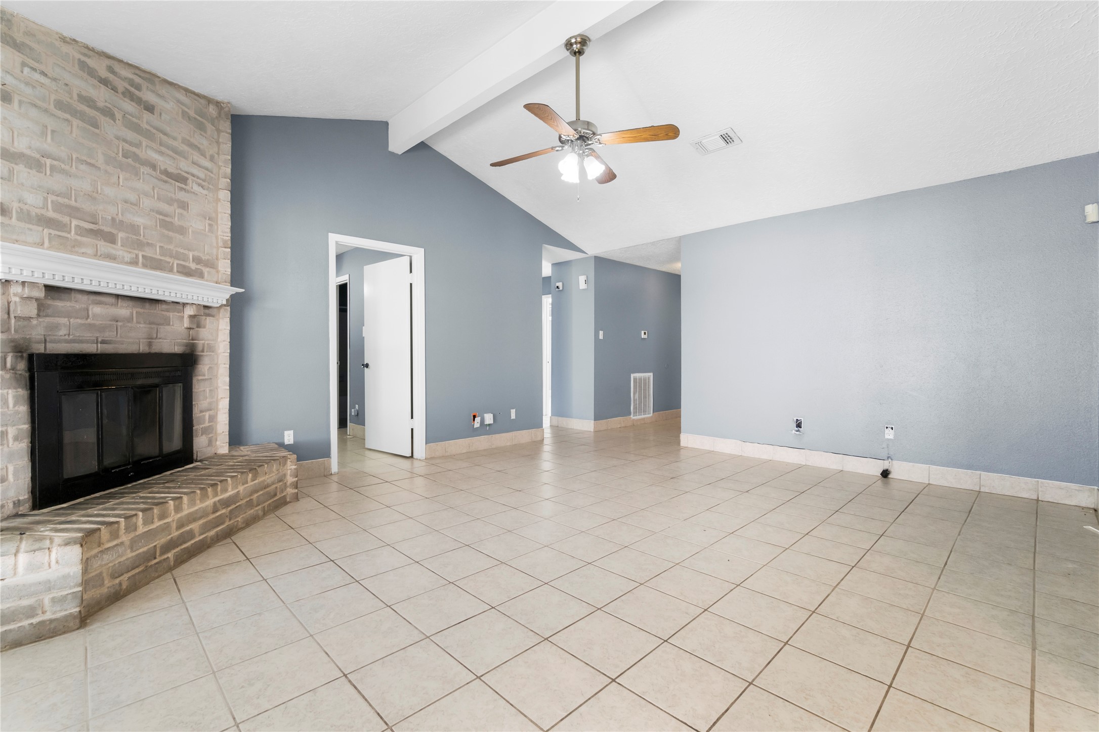 23202 Summergate Drive Spring, TX 77373 - Photo 7 of 16 an empty room with windows and fireplace