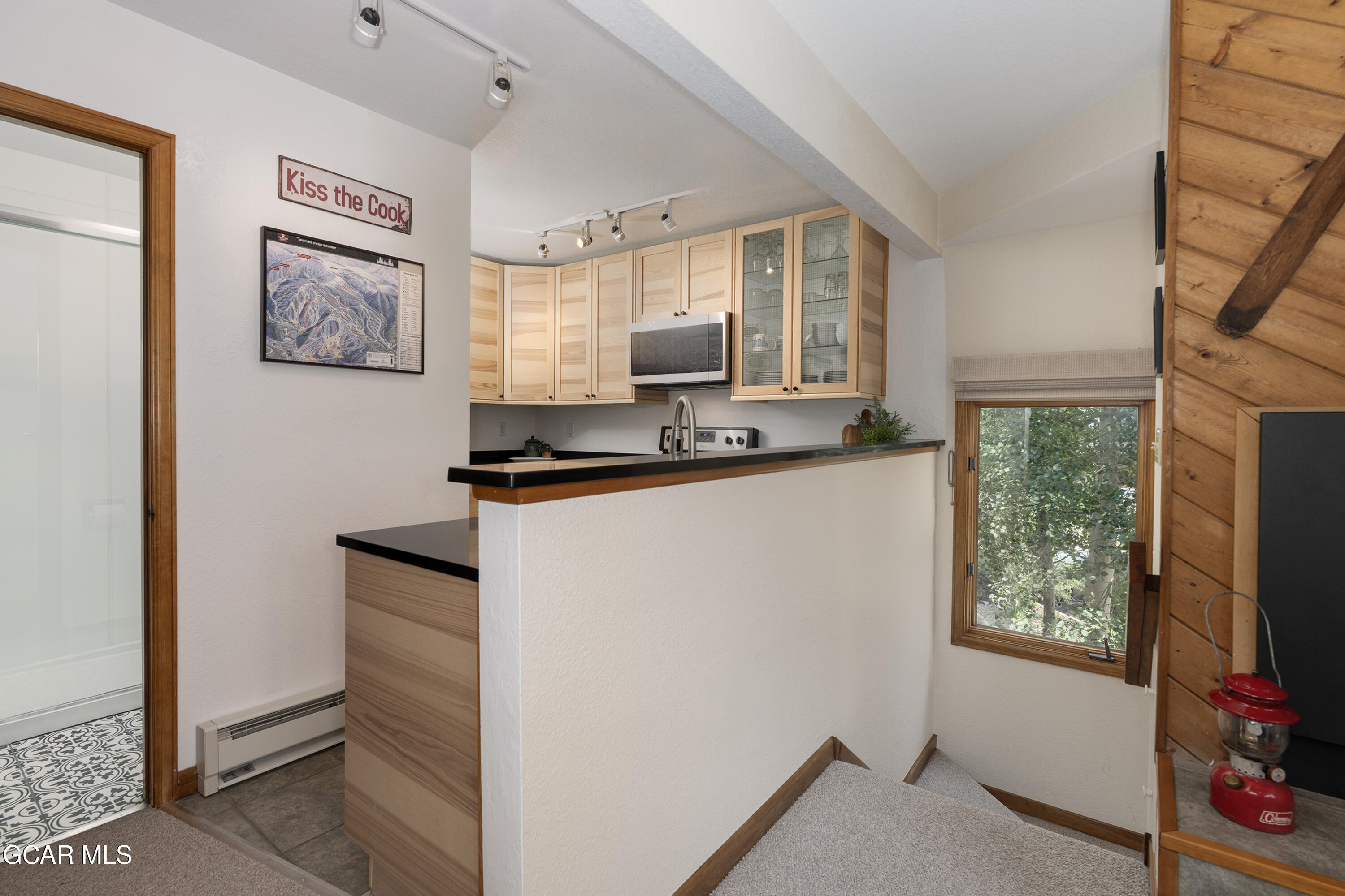 820 Wolverine Lane, Unit 3 Fraser, CO 80442 - Photo 8 of 43 a kitchen with stainless steel appliances granite countertop a sink and a microwave