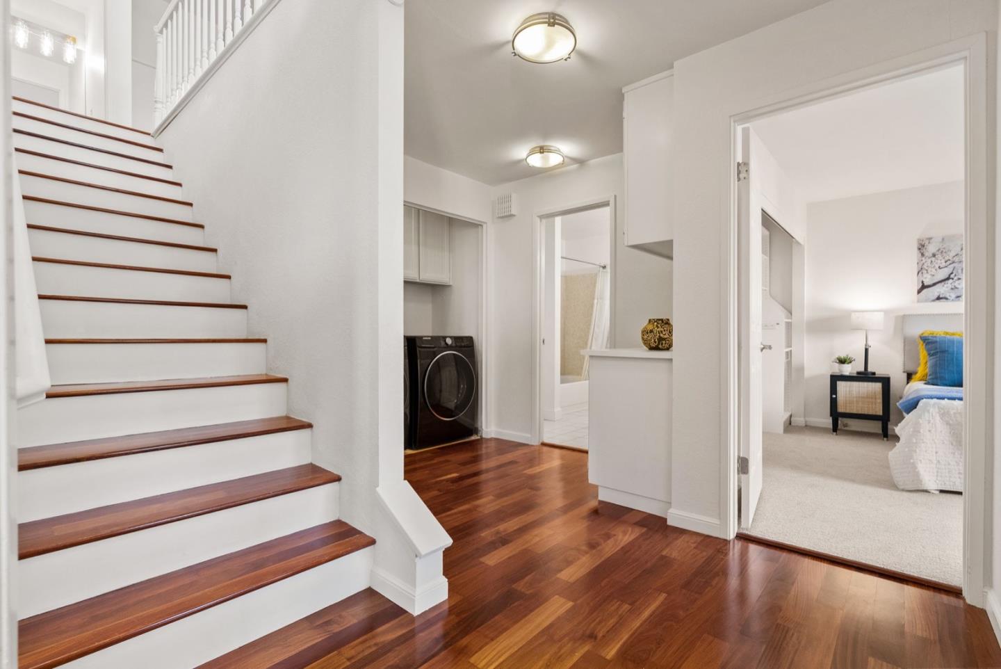 28 Cobblestone Lane Belmont, CA 94002 - Photo 13 of 45 a view of a hallway view with wooden floor and staircase